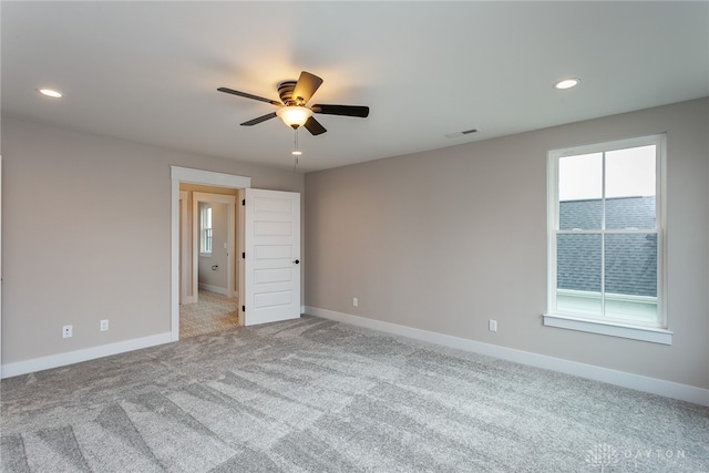 carpeted empty room with ceiling fan