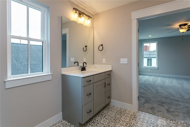 bathroom featuring tile patterned floors, vanity, and ceiling fan