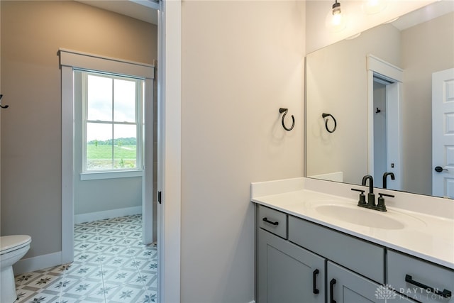 bathroom with vanity and toilet