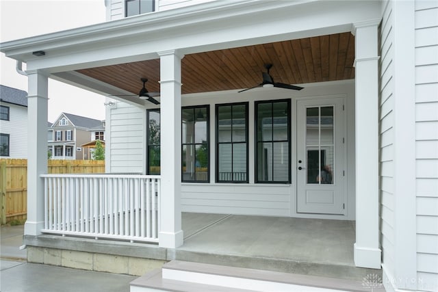 doorway to property with a porch and ceiling fan