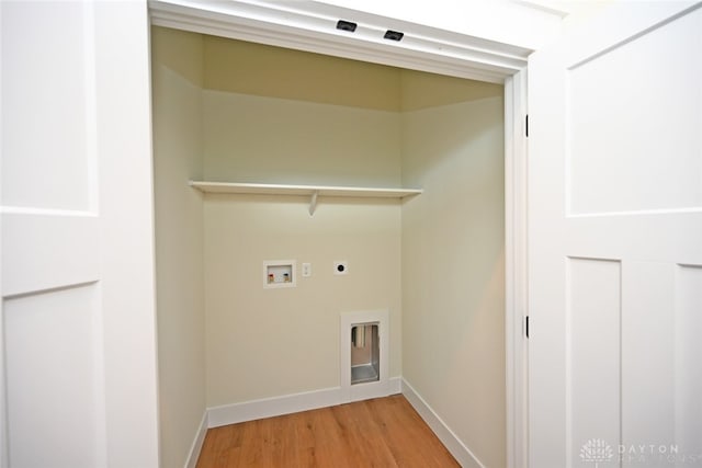 washroom with hookup for a washing machine, hardwood / wood-style floors, and hookup for an electric dryer