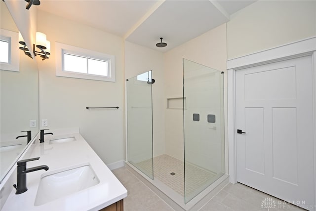 bathroom featuring walk in shower, tile patterned floors, and vanity