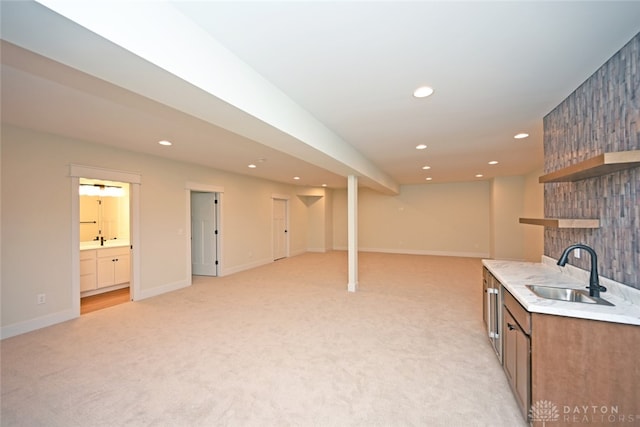 kitchen with light colored carpet, a fireplace, and sink