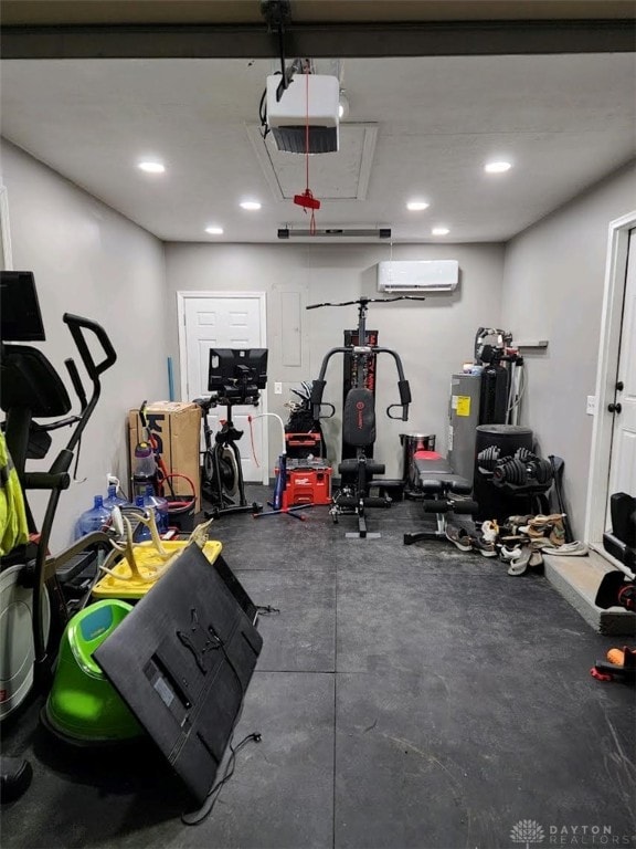 workout room with recessed lighting, attic access, and a wall mounted AC