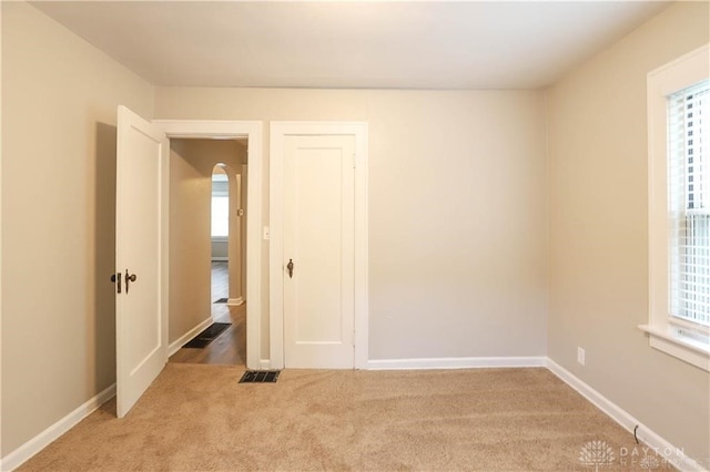 empty room with carpet flooring