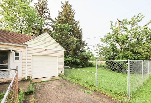 garage with a lawn