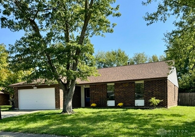 ranch-style house with a front lawn and a garage