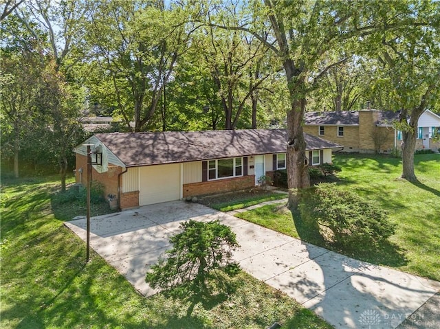 single story home featuring an attached garage, a front lawn, concrete driveway, and brick siding