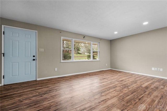 interior space featuring recessed lighting, visible vents, baseboards, and wood finished floors