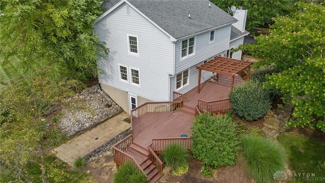 back of house featuring a deck