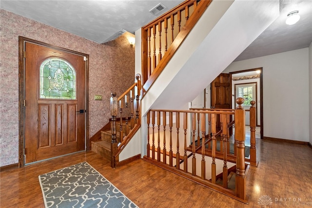 entryway with hardwood / wood-style floors