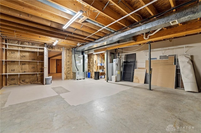 basement with water heater and heating unit