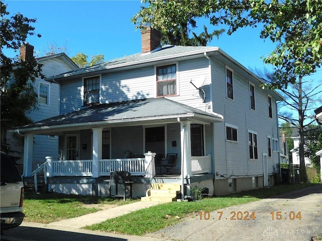 view of front of property featuring covered porch