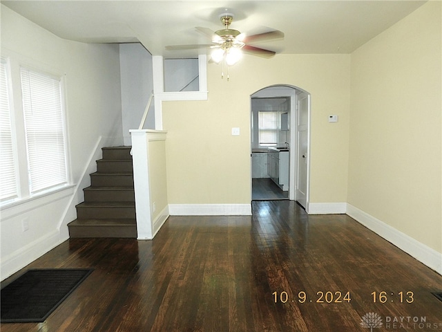 spare room with dark hardwood / wood-style floors and ceiling fan