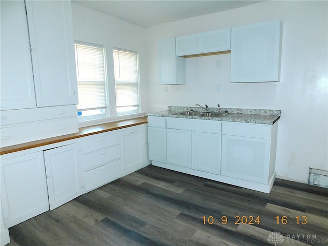 kitchen with white cabinets, dark hardwood / wood-style flooring, and sink