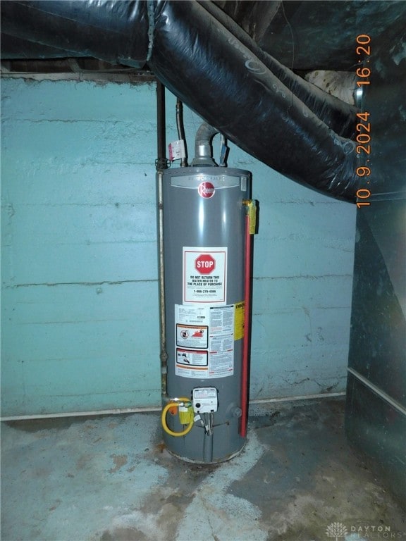 utility room with gas water heater