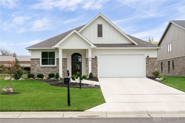 view of front of property with a front yard and a garage