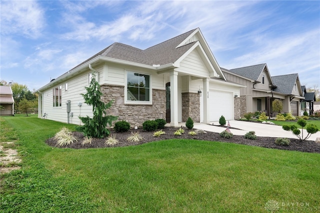 view of front of house featuring a front yard and a garage