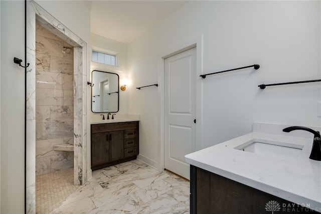 bathroom featuring vanity and tiled shower