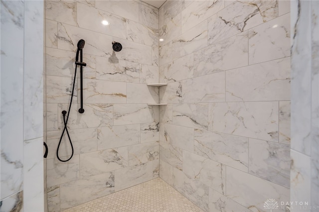 bathroom with tiled shower