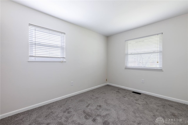 empty room with carpet flooring