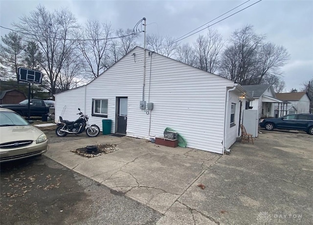 view of side of home with a patio