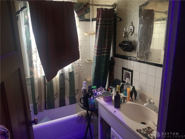 bathroom featuring vanity and shower / tub combo