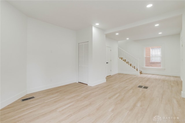 unfurnished room featuring light hardwood / wood-style floors