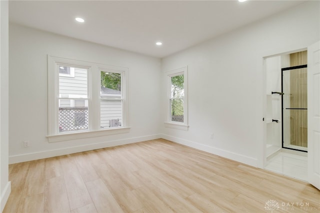 spare room with light hardwood / wood-style floors