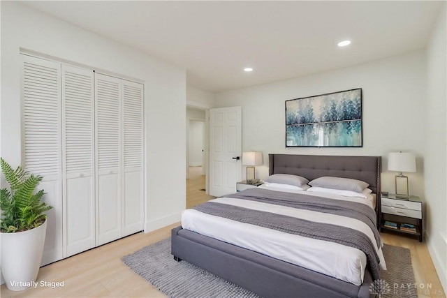 bedroom featuring a closet and light hardwood / wood-style flooring