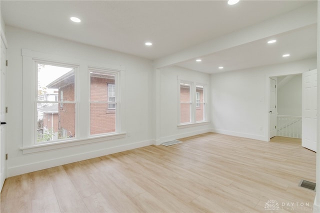 spare room with light wood-type flooring