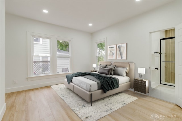 bedroom with light wood-type flooring