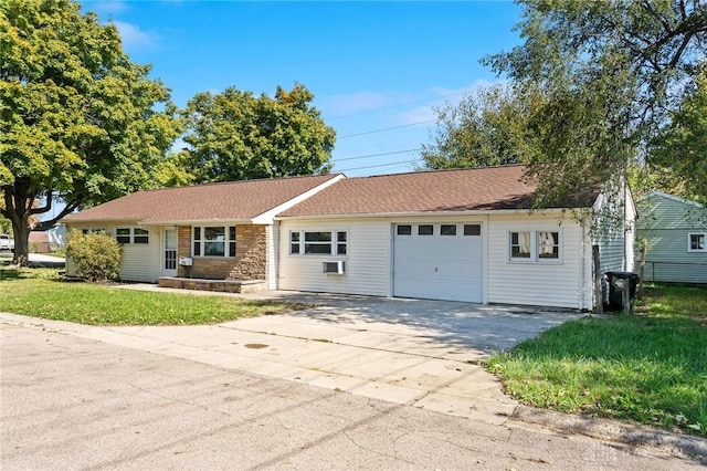 ranch-style home with a garage and a front lawn