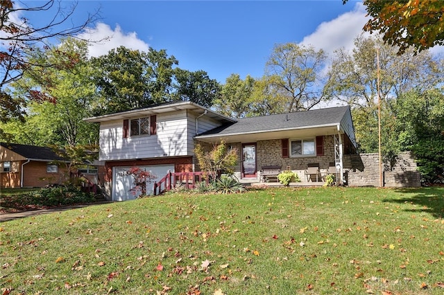 split level home with a garage and a front lawn