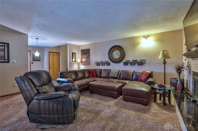 carpeted living room featuring a brick fireplace and a textured ceiling