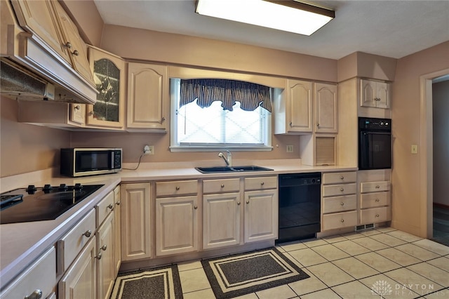 kitchen featuring sink, custom exhaust hood, black appliances, and light tile patterned flooring