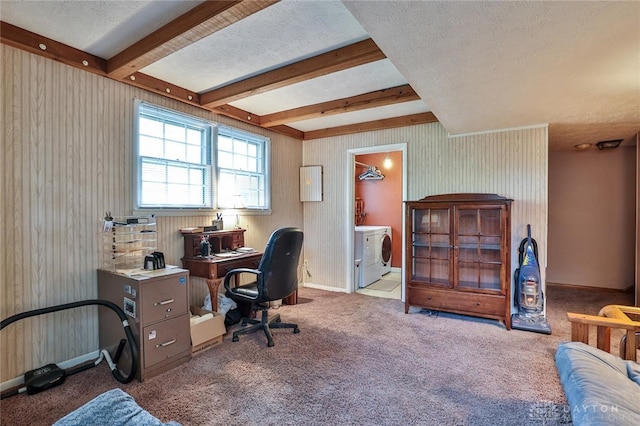 office area featuring carpet floors, a textured ceiling, washer and clothes dryer, and beamed ceiling