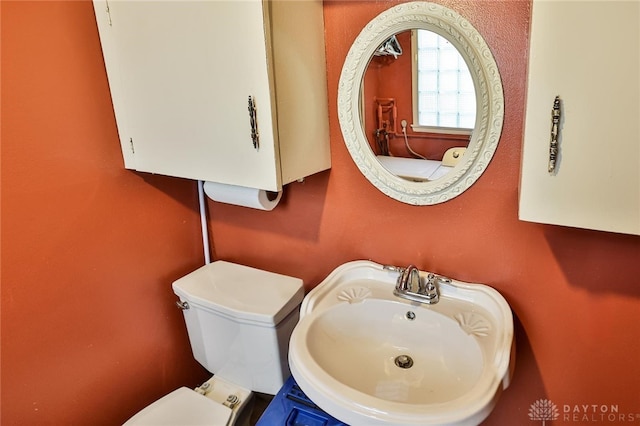 bathroom featuring sink and toilet