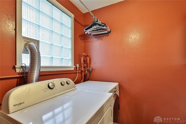 clothes washing area featuring washing machine and clothes dryer