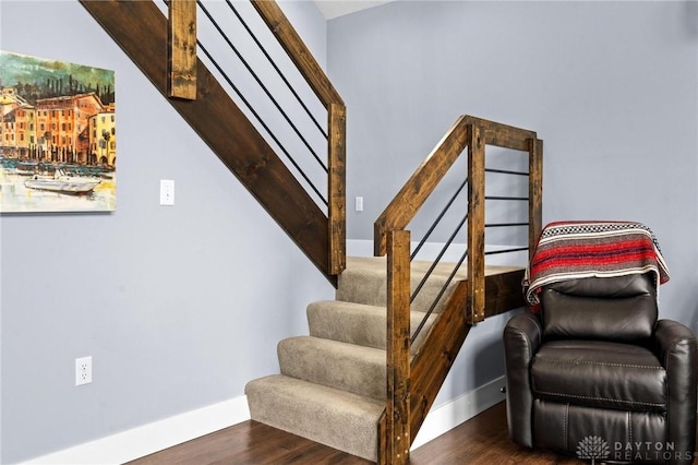 stairs with hardwood / wood-style flooring