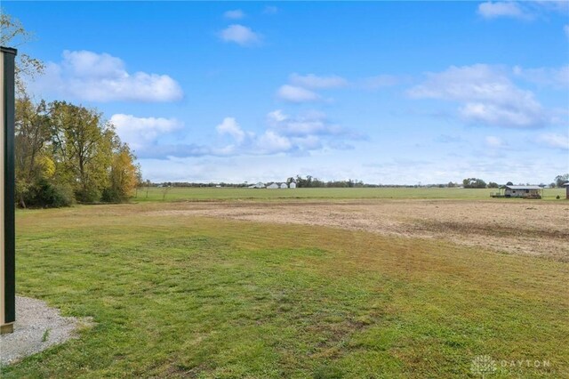 view of yard with a rural view