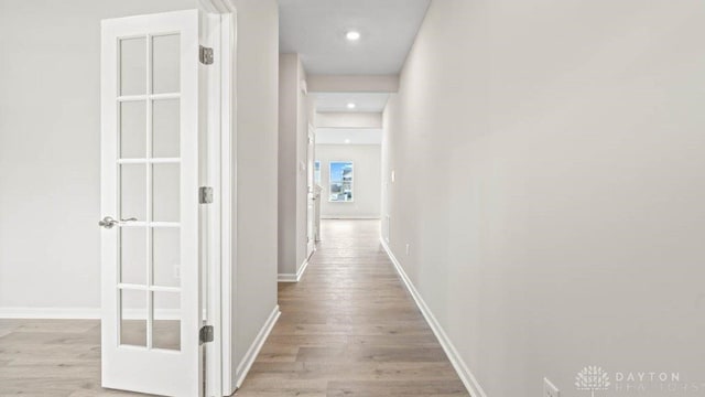 corridor featuring light wood-type flooring