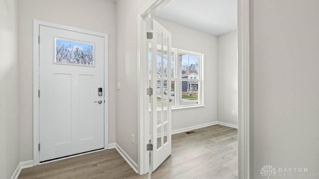 entrance foyer with light hardwood / wood-style floors