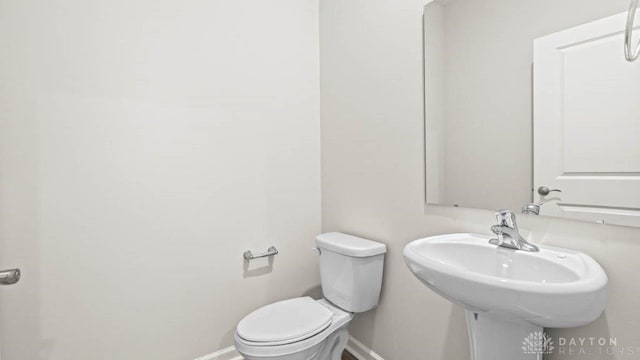 bathroom with toilet and sink