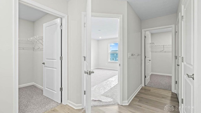 hallway with light wood-type flooring