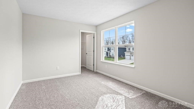 unfurnished room featuring carpet