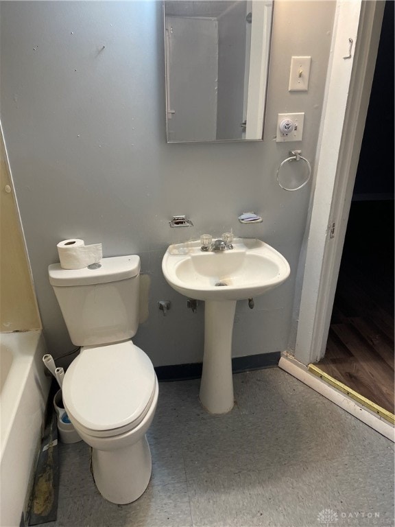 bathroom featuring toilet and shower with separate bathtub