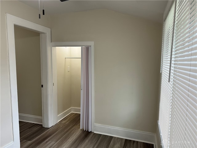 unfurnished bedroom featuring dark wood-type flooring