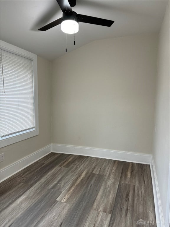 unfurnished room with dark hardwood / wood-style floors, ceiling fan, and vaulted ceiling