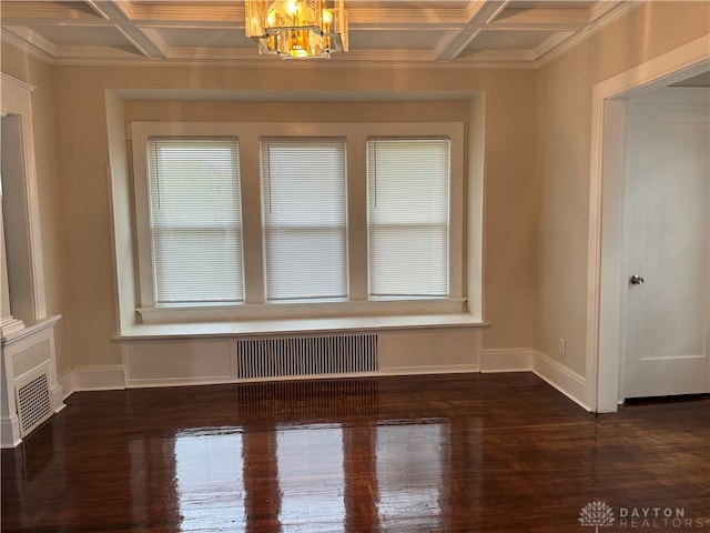 unfurnished room with beamed ceiling, coffered ceiling, a chandelier, and dark hardwood / wood-style flooring